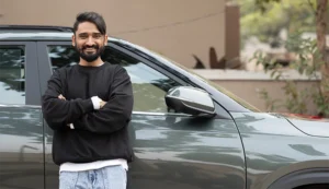 Man proud of his nice clean car.